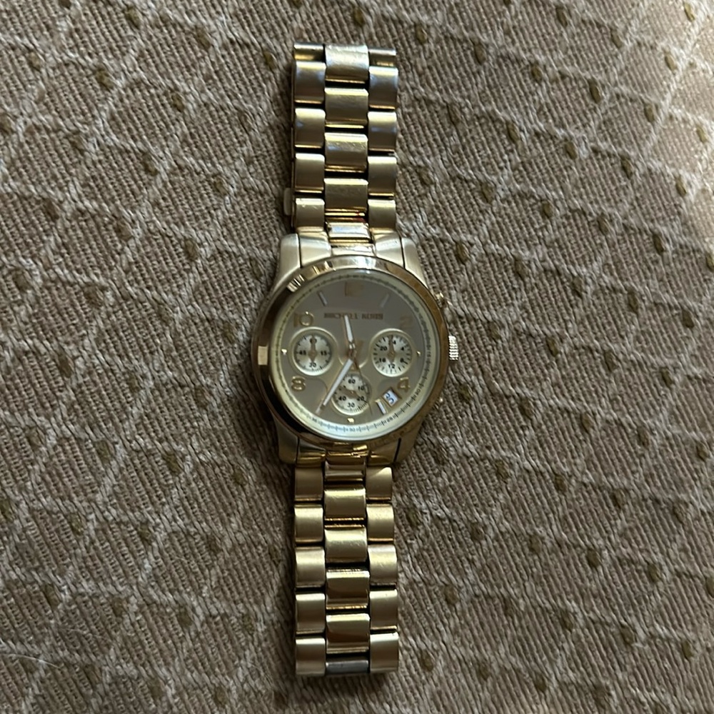 Michael Kors watch. Gold color. Good used condition. Needs a battery.